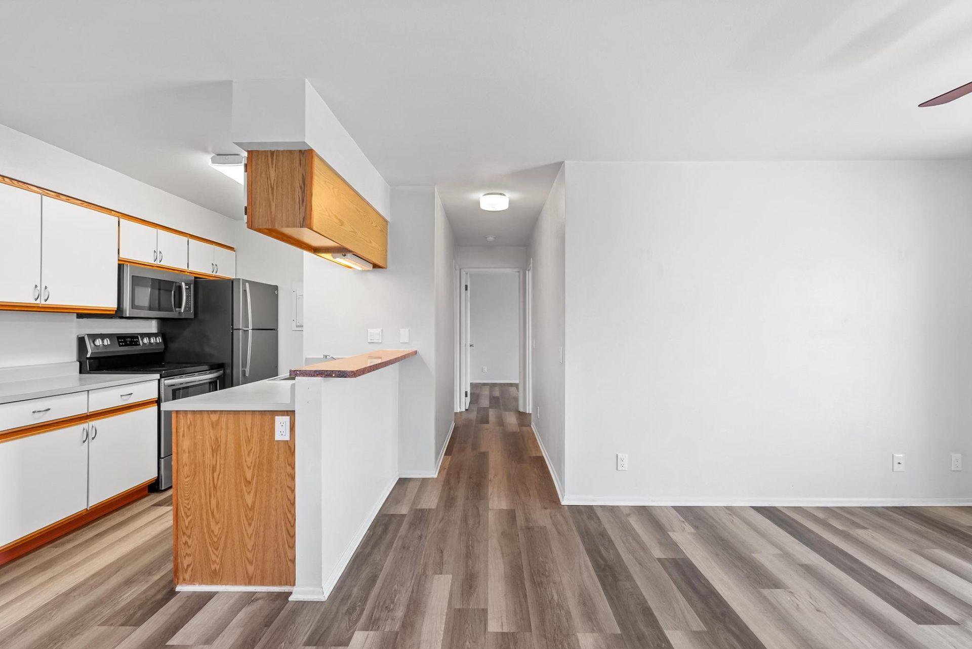 Open kitchen and living area with luxury vinyl plank flooring