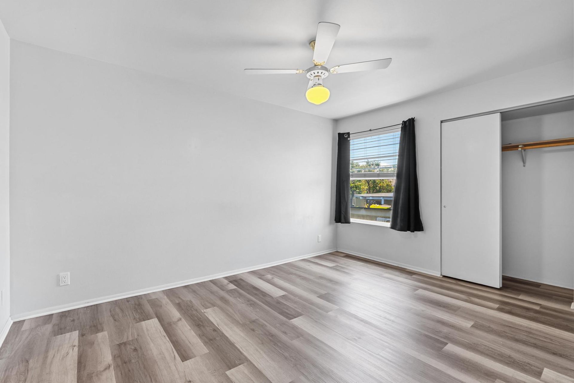Primary bedroom filled with natural light and large closet