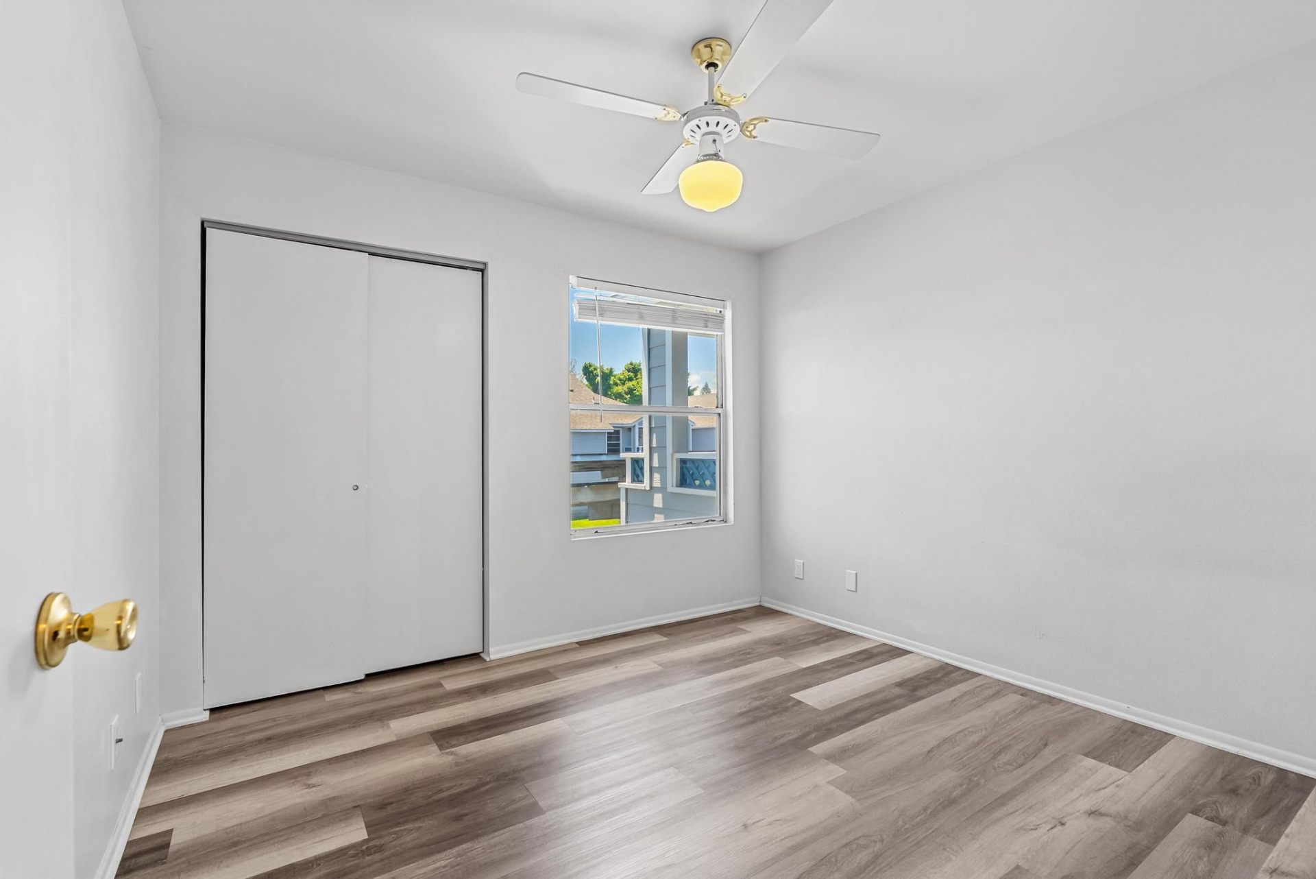 Second bedroom with bright window and closet