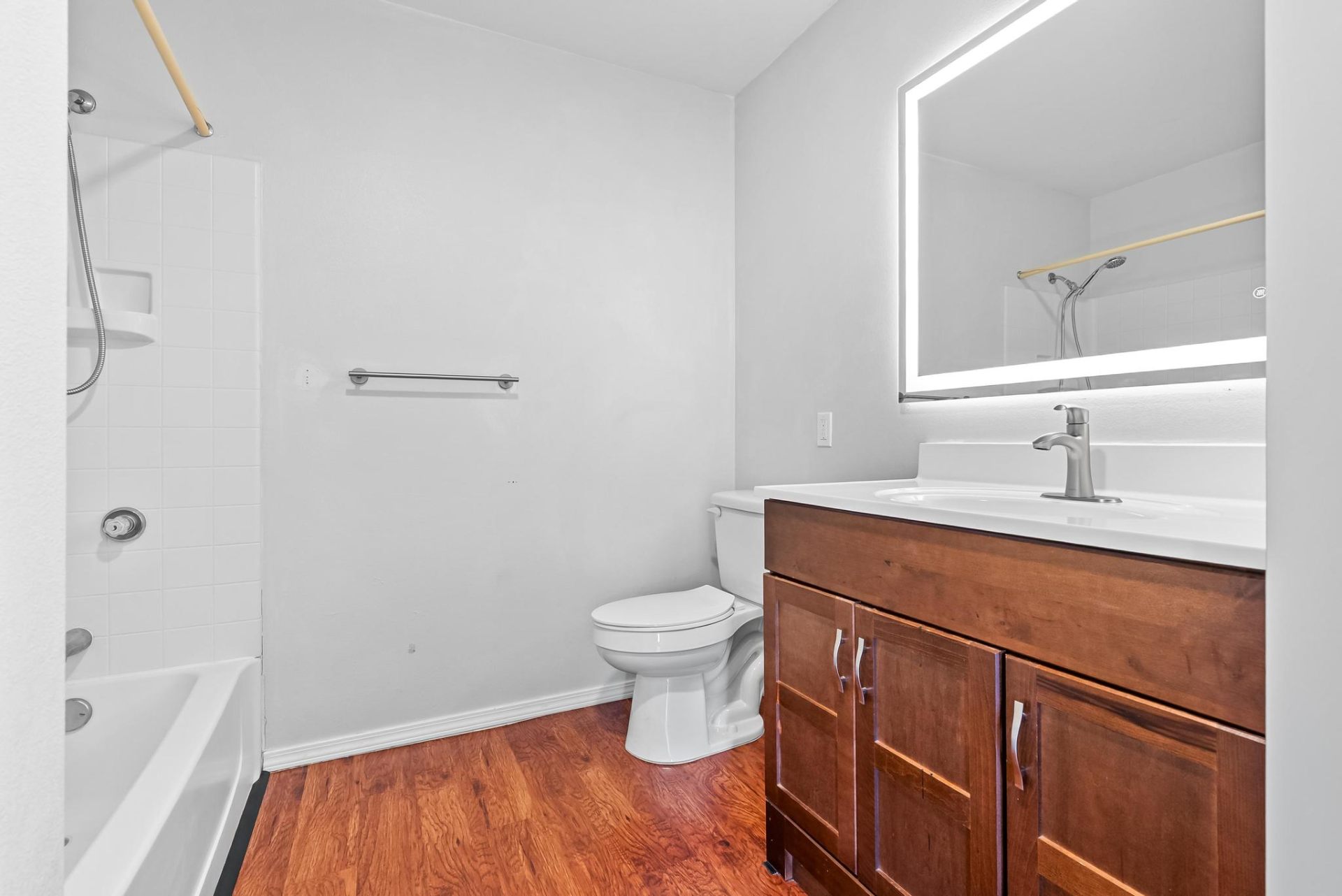 Second full bathroom with refreshed vanity and LED mirror