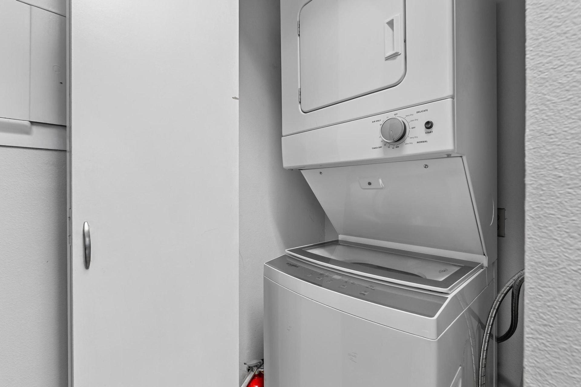 In-unit stacked washer and dryer closet
